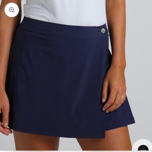 NWT Puma navy resort, rap, mini golf Skirt with attached shorts size M.
And L.